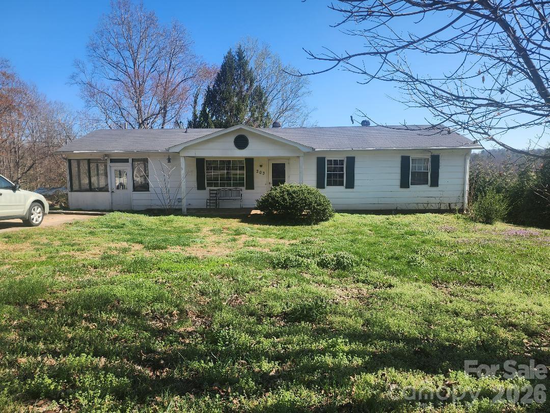 203 Brentwood Road, Unit 61 Morganton, NC 28655 - Photo 2 of 11 a front view of a house with yard and trees