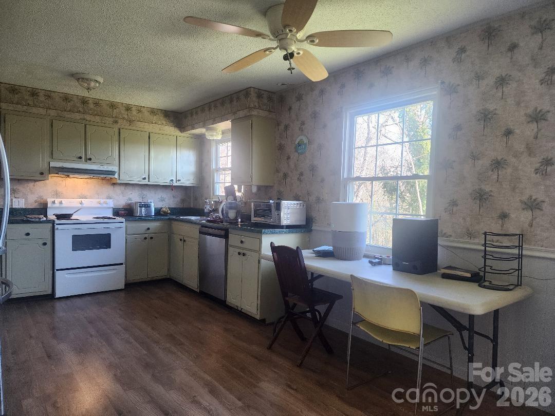 203 Brentwood Road, Unit 61 Morganton, NC 28655 - Photo 4 of 11 a kitchen with a sink cabinets and window