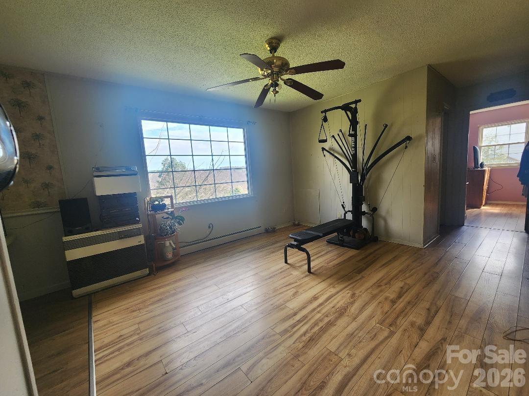 203 Brentwood Road, Unit 61 Morganton, NC 28655 - Photo 5 of 11 a view of a room with wooden floor and windows