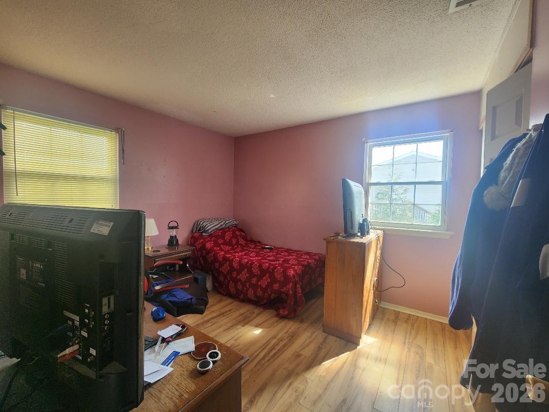 203 Brentwood Road, Unit 61 Morganton, NC 28655 - Photo 6 of 11 a living room with furniture and a window