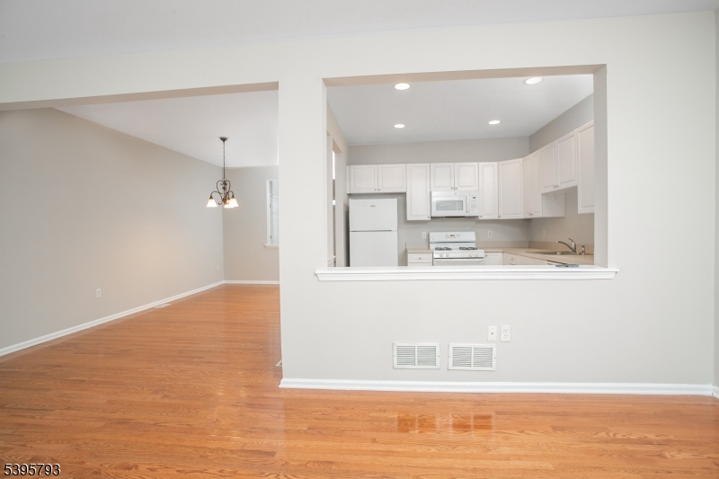 58 Autumn Ridge Road Morris Plains, NJ 07950 - Photo 12 of 30 a view of kitchen with microwave and cabinets