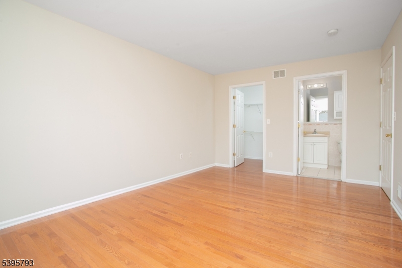 58 Autumn Ridge Road Morris Plains, NJ 07950 - Photo 16 of 30 a view of an empty room and wooden floor