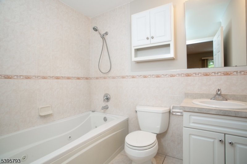 58 Autumn Ridge Road Morris Plains, NJ 07950 - Photo 22 of 30 a bathroom with a sink a toilet and a bathtub