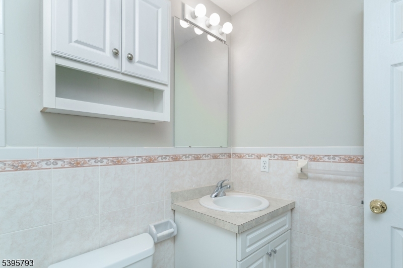 58 Autumn Ridge Road Morris Plains, NJ 07950 - Photo 23 of 30 a bathroom with a sink vanity granite and toilet