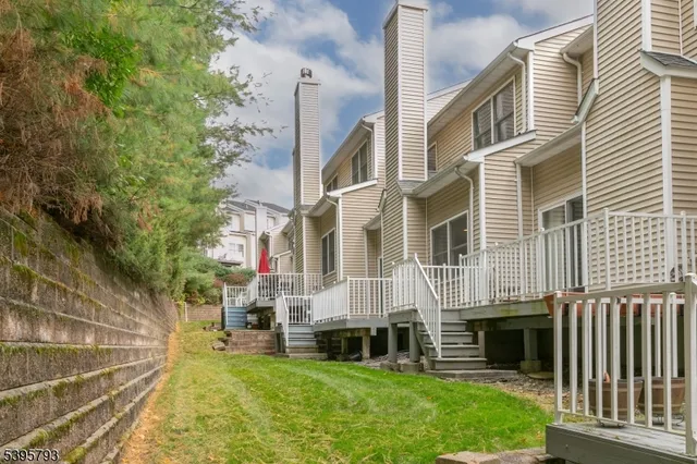a view of an apartment with a backyard