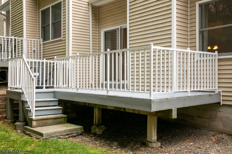 58 Autumn Ridge Road Morris Plains, NJ 07950 - Photo 29 of 30 a backyard of a house with table and chairs