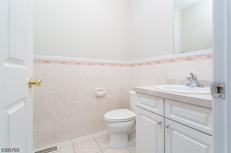 58 Autumn Ridge Road Morris Plains, NJ 07950 - Photo 5 of 30 a bathroom with a sink a toilet and a mirror