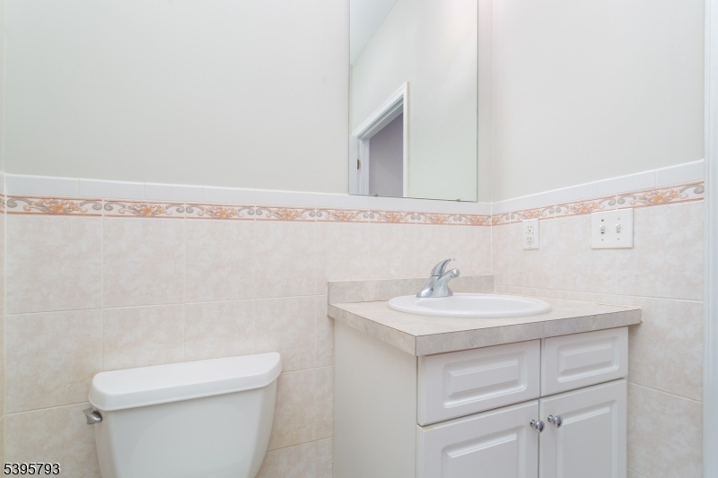 58 Autumn Ridge Road Morris Plains, NJ 07950 - Photo 6 of 30 a bathroom with a sink a toilet and a mirror