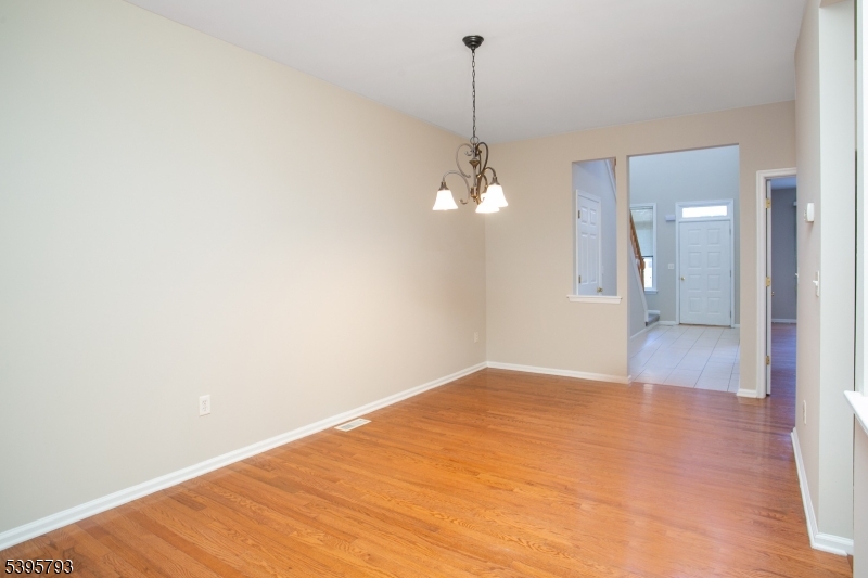 58 Autumn Ridge Road Morris Plains, NJ 07950 - Photo 10 of 30 a view of an empty room with a chandelier