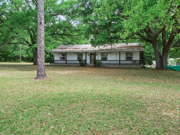 a house with a tree in front of it