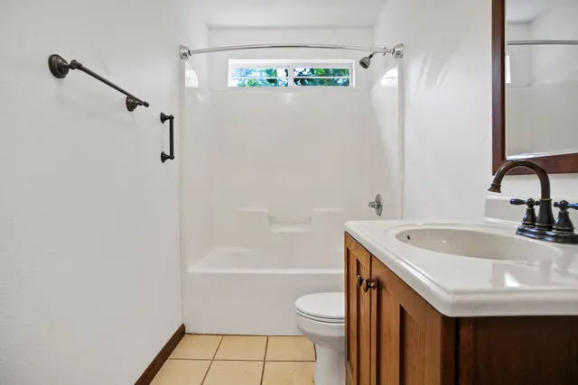 front view of a house with a trees