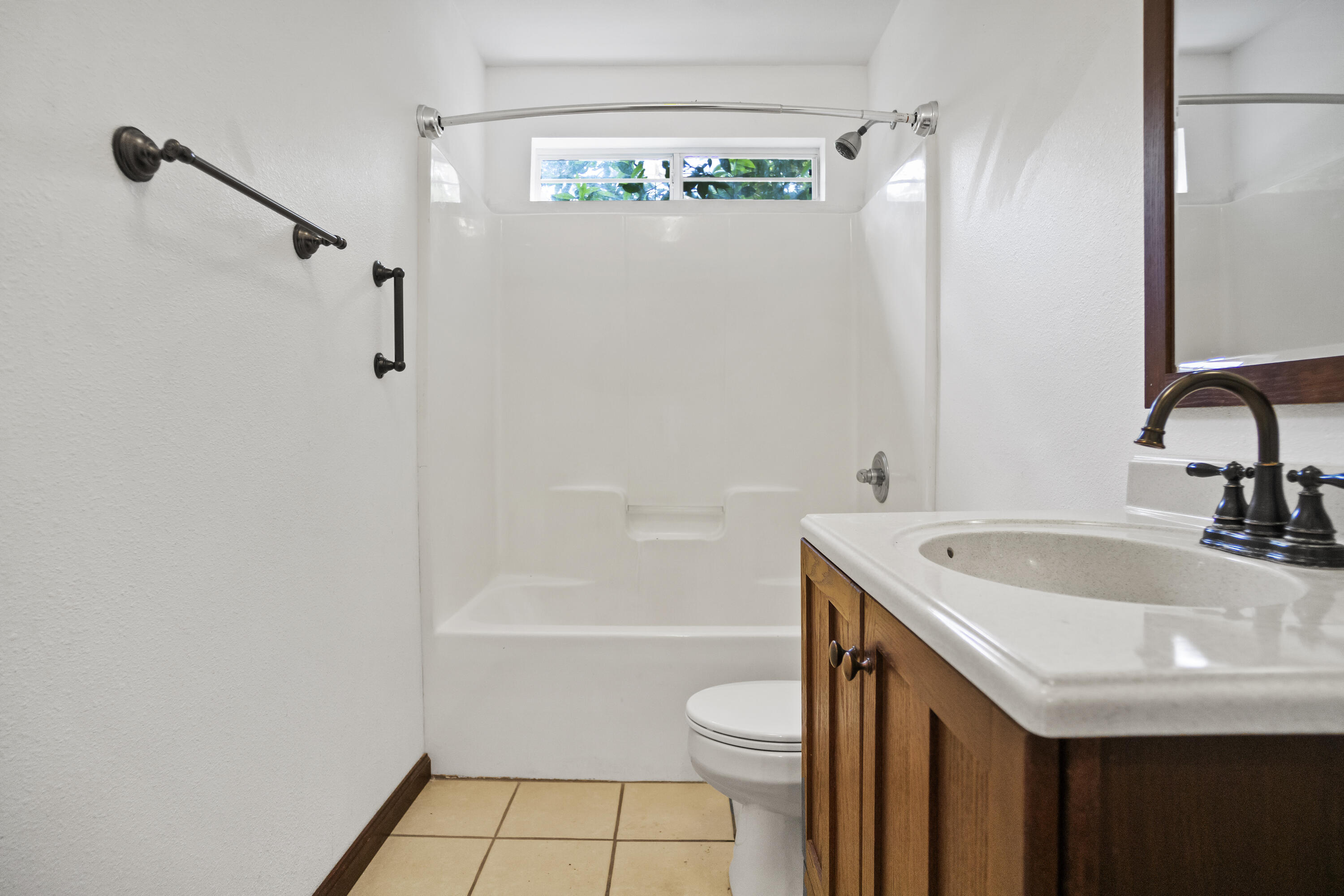 15766 Northeast Bob Sanders Road Hosford, FL 32334 - Photo 21 of 33 a bathroom with a sink a toilet and shower