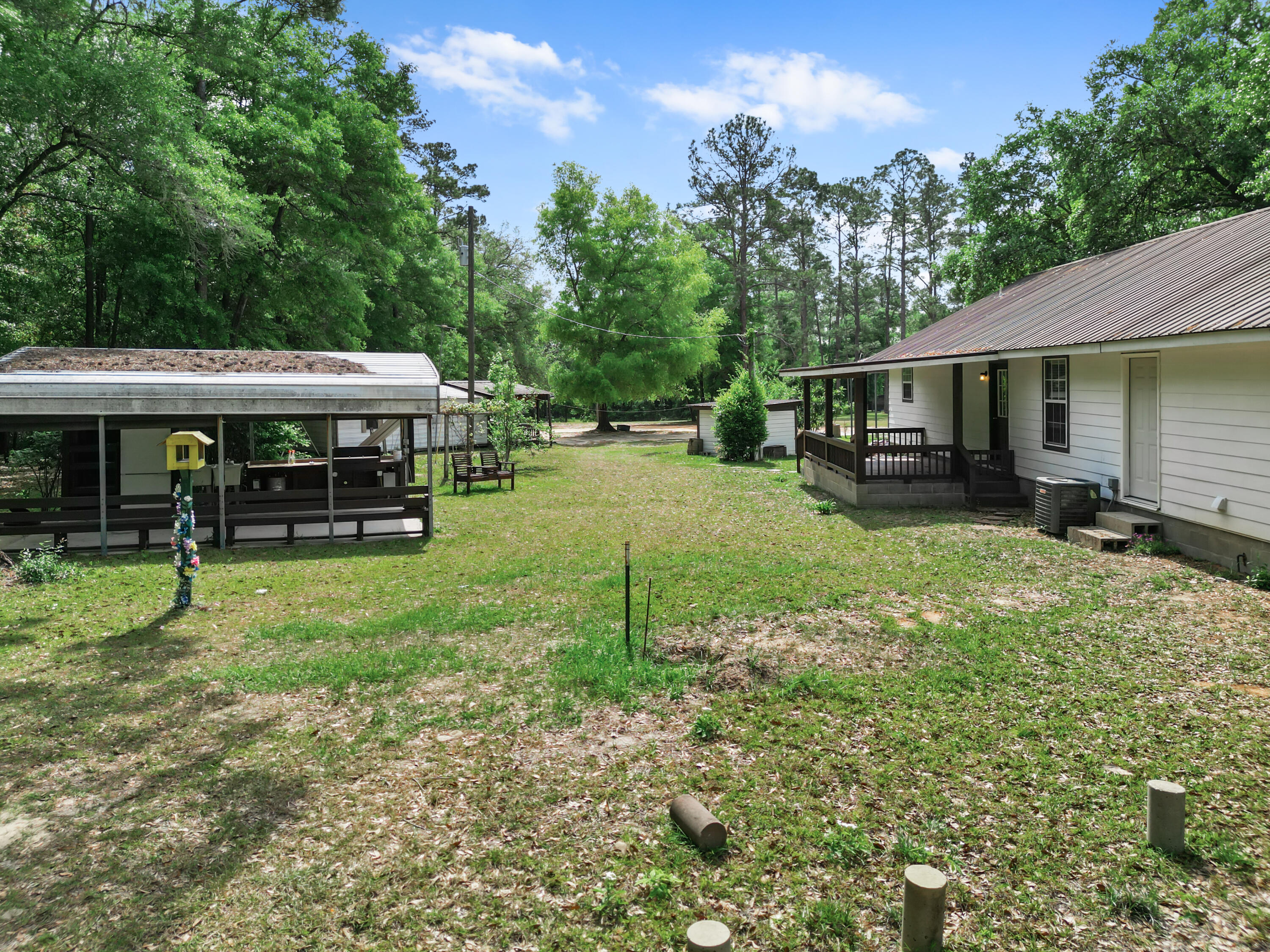 15766 Northeast Bob Sanders Road Hosford, FL 32334 - Photo 28 of 33 a view of a house with backyard porch and sitting area
