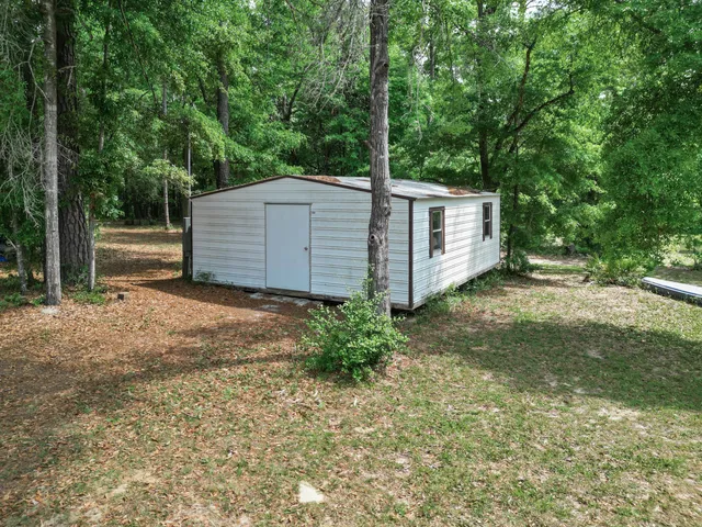 an aerial view of residential house with outdoor space