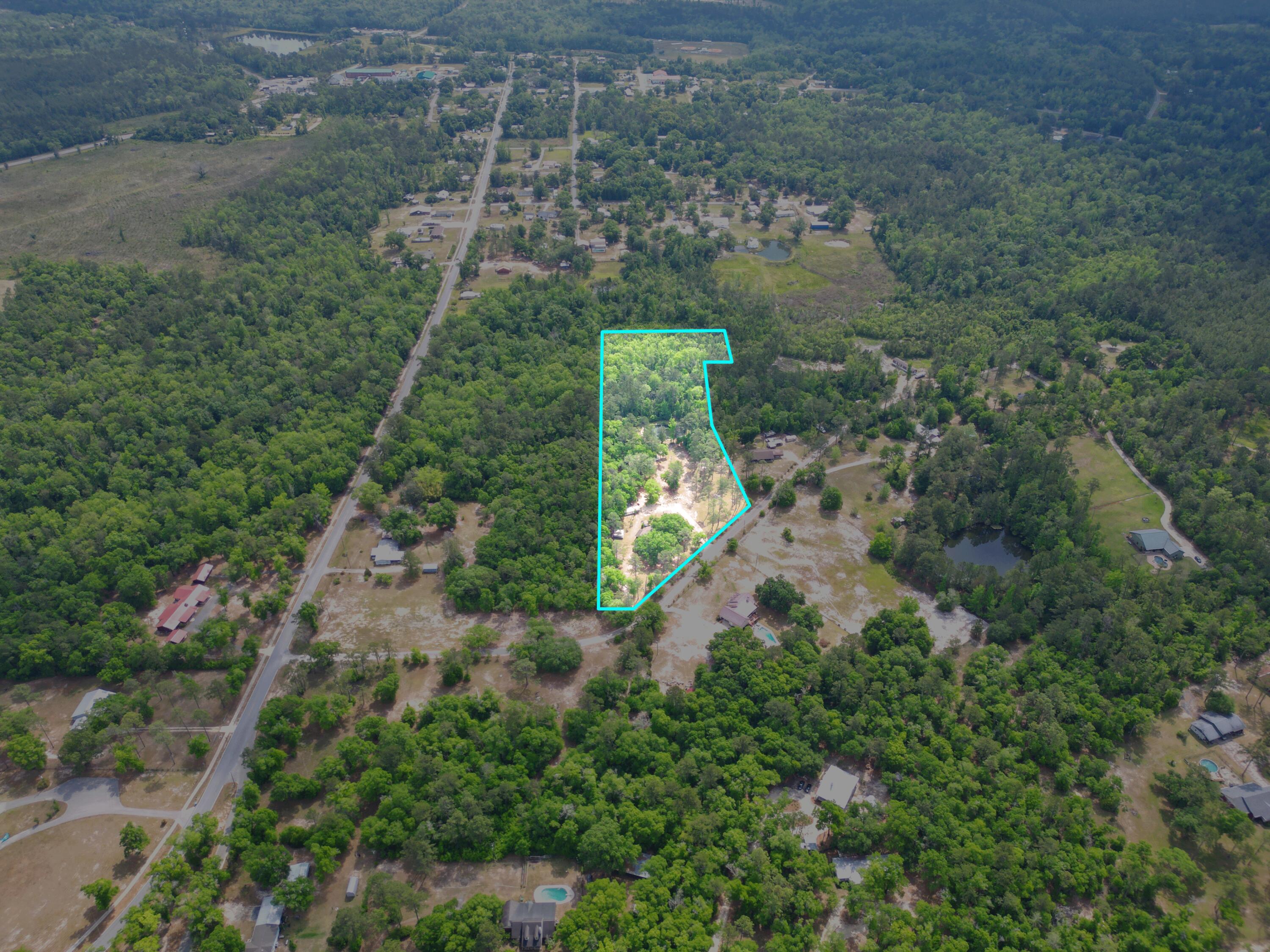 15766 Northeast Bob Sanders Road Hosford, FL 32334 - Photo 33 of 33 an aerial view of residential house with outdoor space