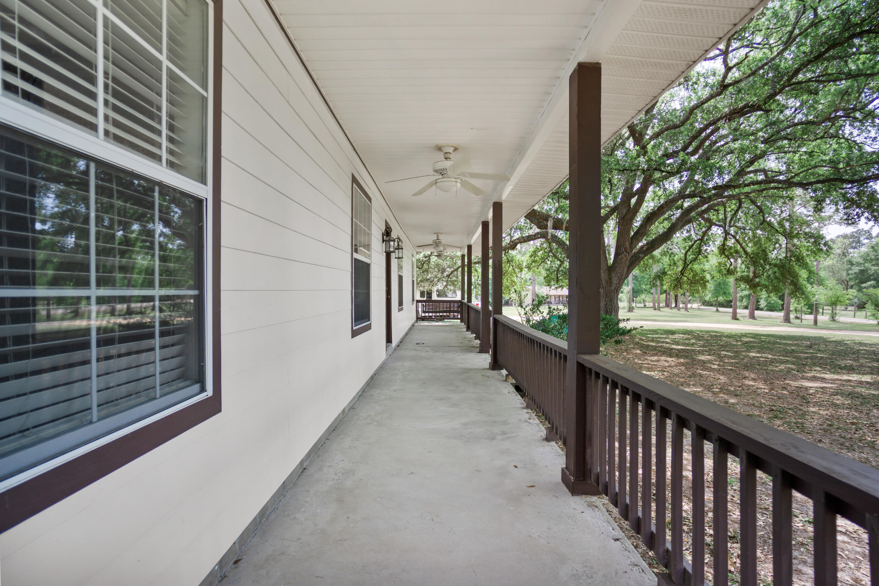 15766 Northeast Bob Sanders Road Hosford, FL 32334 - Photo 4 of 33 a view of a pathway of a house with a tree