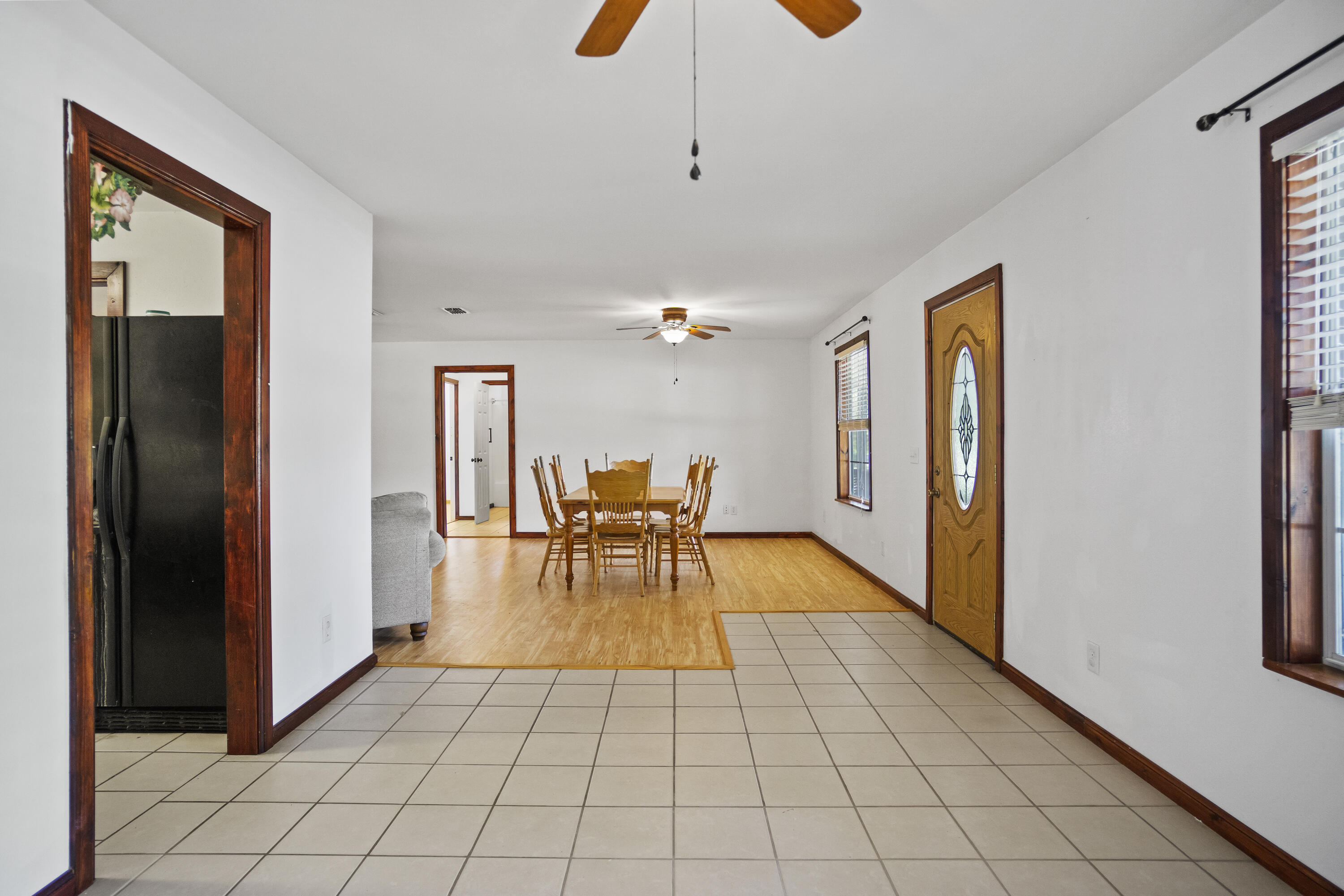 15766 Northeast Bob Sanders Road Hosford, FL 32334 - Photo 9 of 33 a view of a livingroom with dining area wooden floor and chandelier