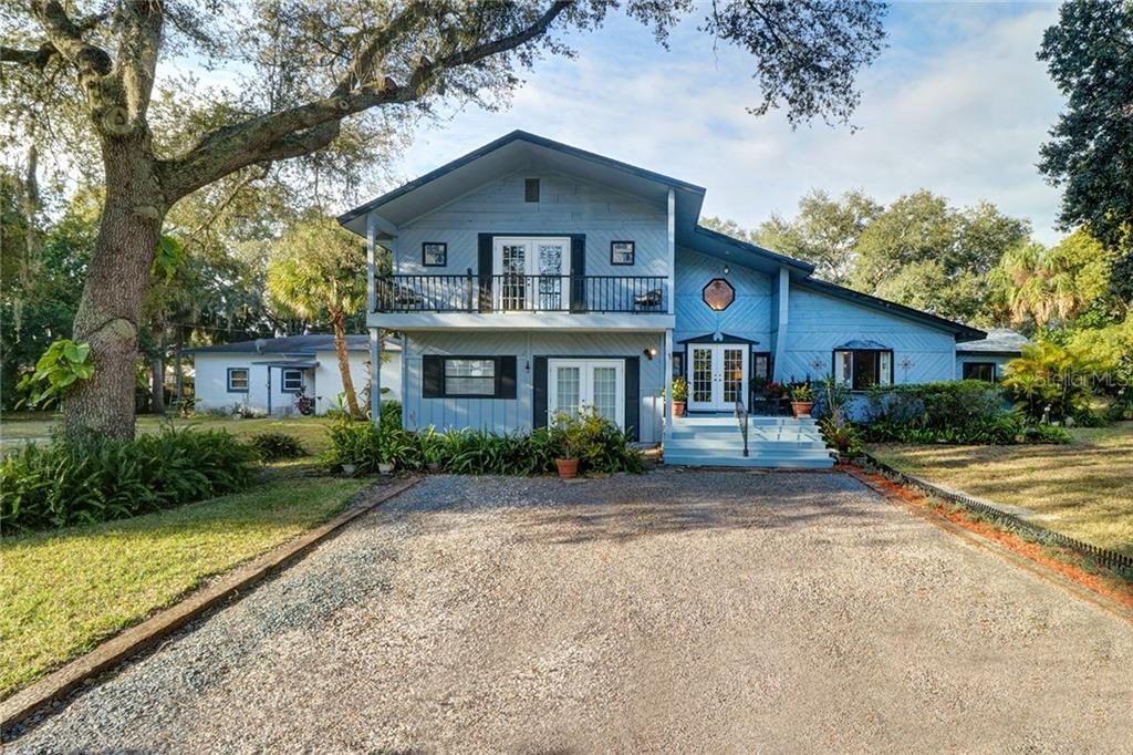 6425 River Road New Port Richey, FL 34652 - Photo 1 of 1 a front view of a house with a yard
