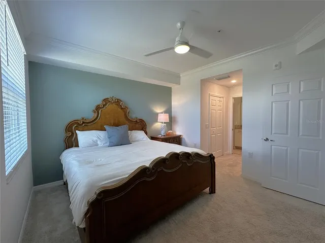 a bathroom with a granite countertop sink a toilet a mirror and shower