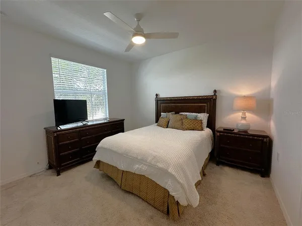 a large bed sitting in a bedroom and closet