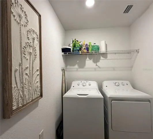 a view of a chairs and table in patio