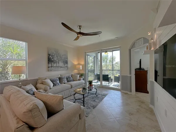 a kitchen with sink refrigerator and microwave