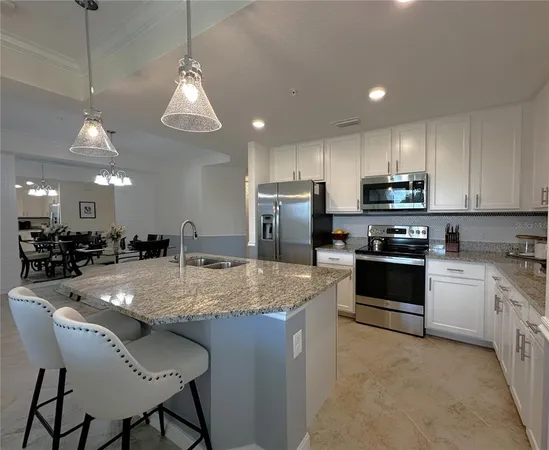 a view of kitchen island with granite countertop living room and living room