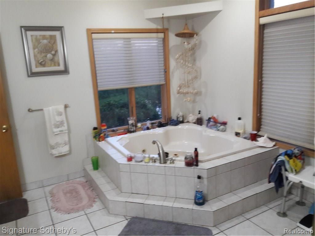 5000 Lake Pleasant Road North Branch, MI 48461 - Photo 5 of 34 double person jetted tub with built in heater. What better way to relax after a long day! Remove your stress as you absorb the view of paradise from your very own tub!! It never cools down so it stays the same temp until you are done soaking your day away.