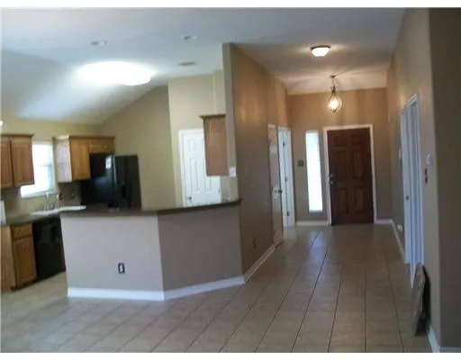 a view of kitchen with stainless steel appliances kitchen island