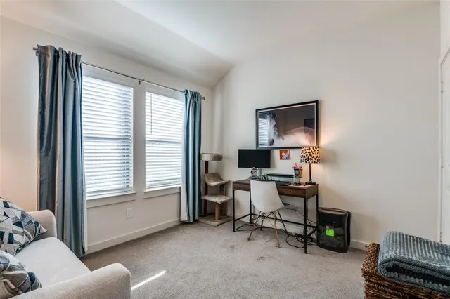 a work room with furniture and a window