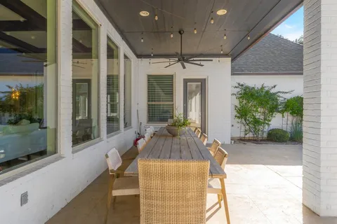 a swimming pool with outdoor seating and yard