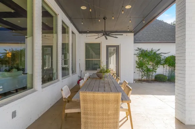 a swimming pool with outdoor seating and yard