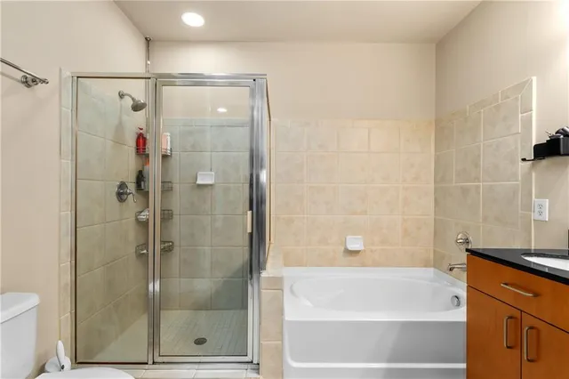 a bathroom with a shower and a bathtub
