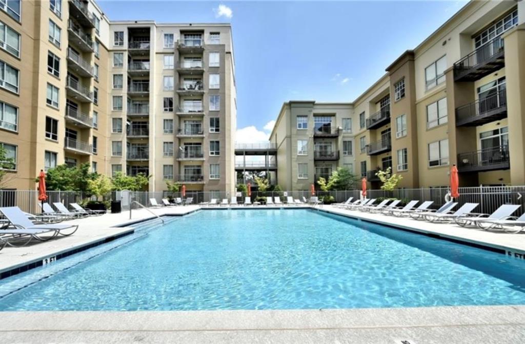 711 Cosmopolitan Drive Northeast, Unit 517 Atlanta, GA 30324 - Photo 21 of 29 a view of pool with outdoor seating
