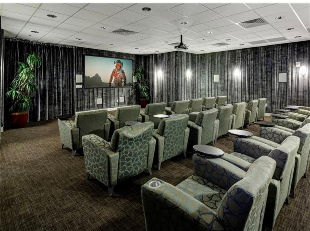 711 Cosmopolitan Drive Northeast, Unit 517 Atlanta, GA 30324 - Photo 27 of 29 a living room with furniture and a large window