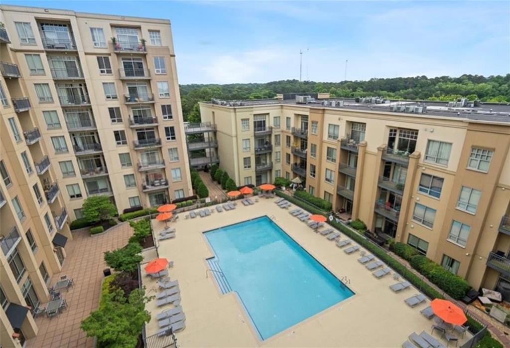 711 Cosmopolitan Drive Northeast, Unit 517 Atlanta, GA 30324 - Photo 29 of 29 a view of balcony with a yard