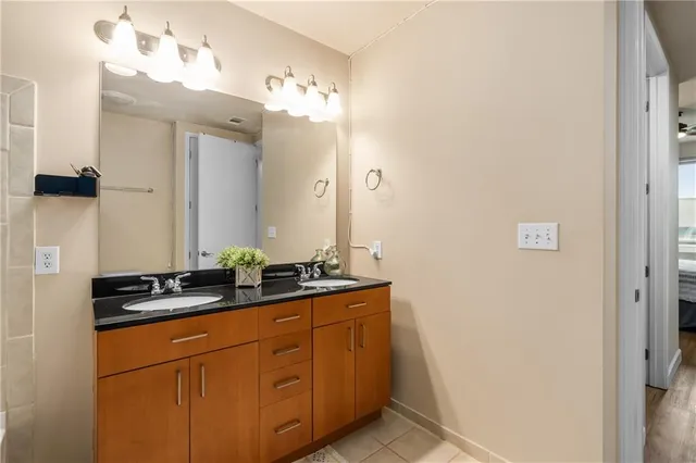 a bathroom with a sink and a mirror