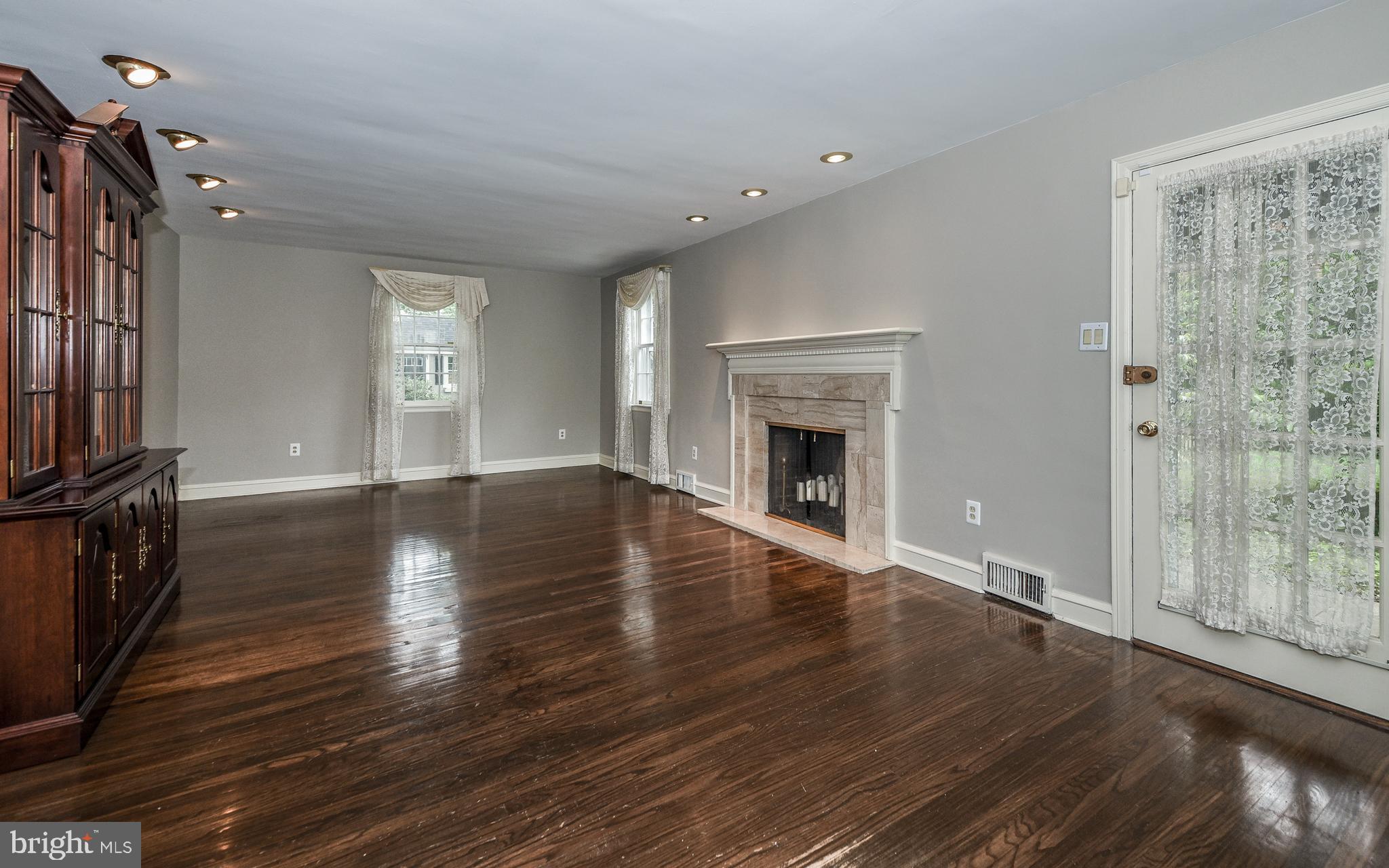 7804 Conwell Road Glenside, PA 19038 - Photo 14 of 33 Living Room with Walk out to Covered Patio