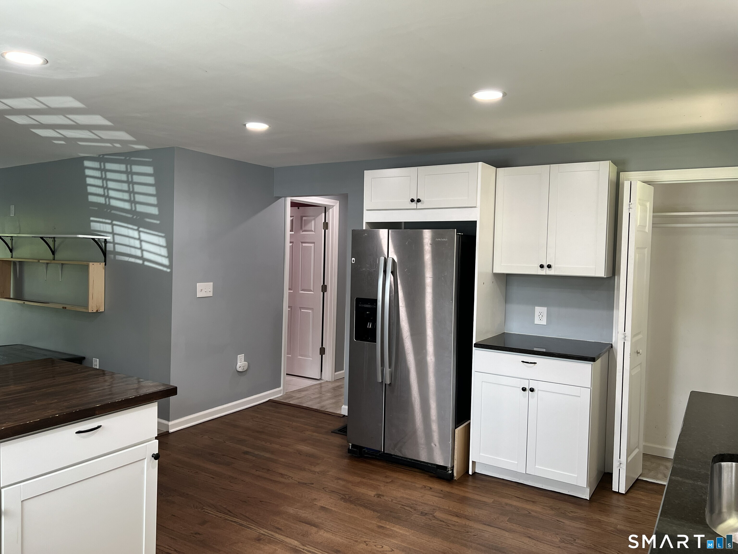 82 Bingham Street Bristol, CT 06010 - Photo 5 of 40 a kitchen with granite countertop a refrigerator and a stove top oven