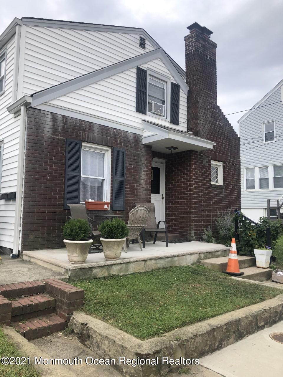 16 Via Ripa Sea Bright, NJ 07760 - Photo 1 of 5 a front view of a house with garden and plants