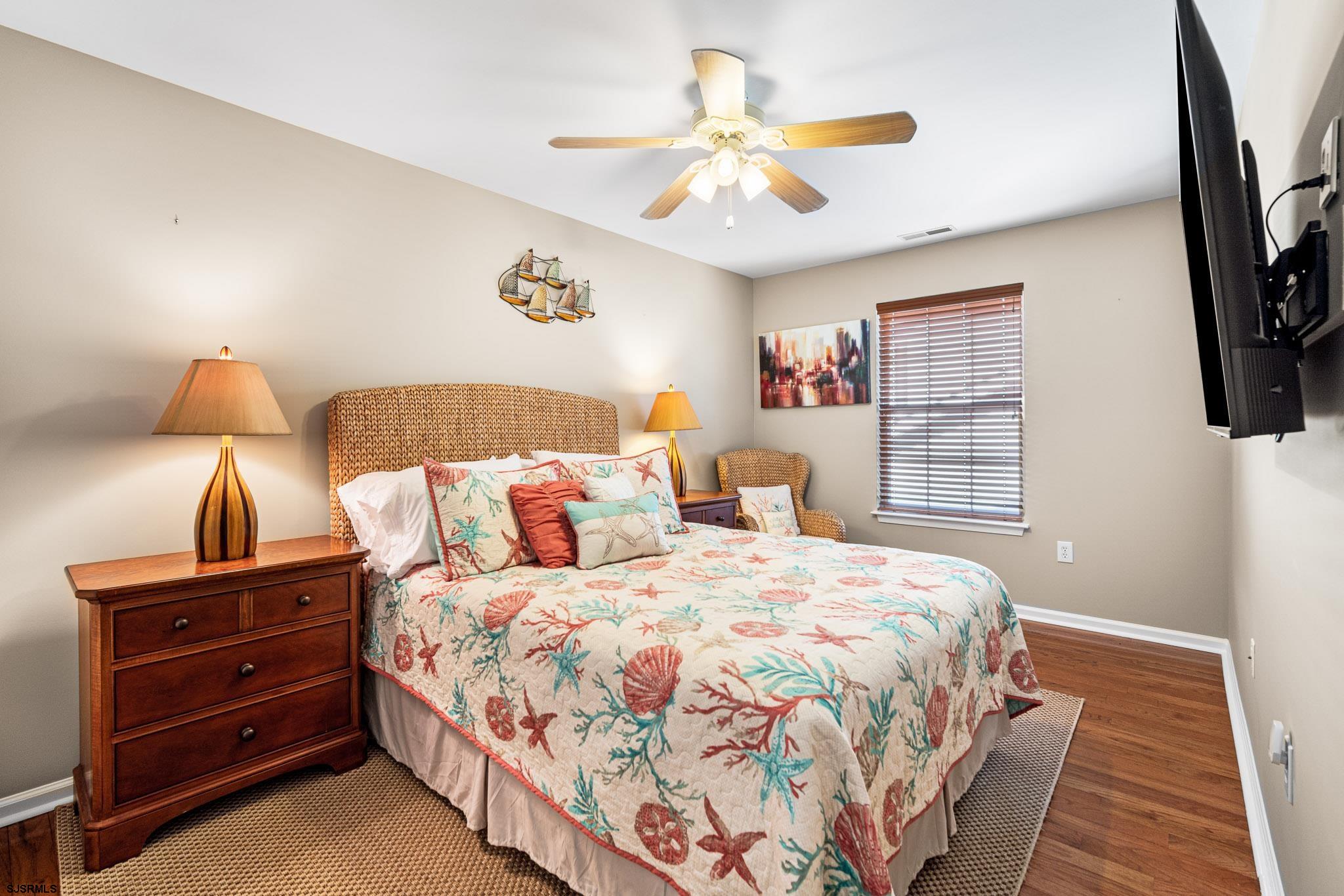 5 Collette Circle Brigantine, NJ 08203 - Photo 16 of 36 a bedroom with a bed and a flat screen tv