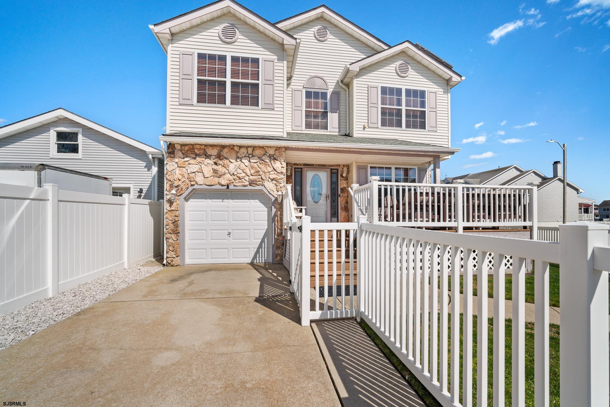 5 Collette Circle Brigantine, NJ 08203 - Photo 2 of 36 a view of a white house with wooden fence