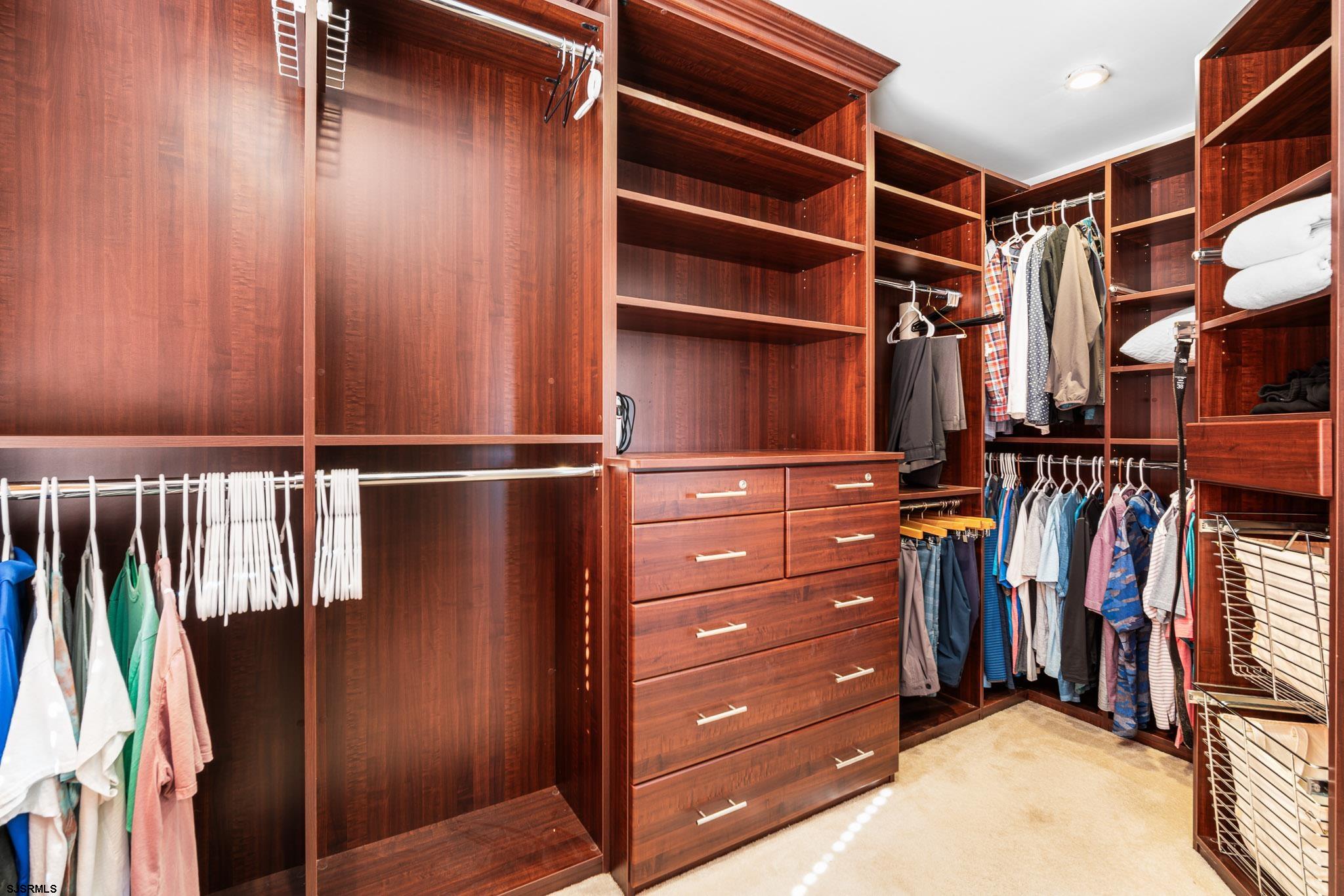 5 Collette Circle Brigantine, NJ 08203 - Photo 23 of 36 a view of walk in closet with clothes and shoes