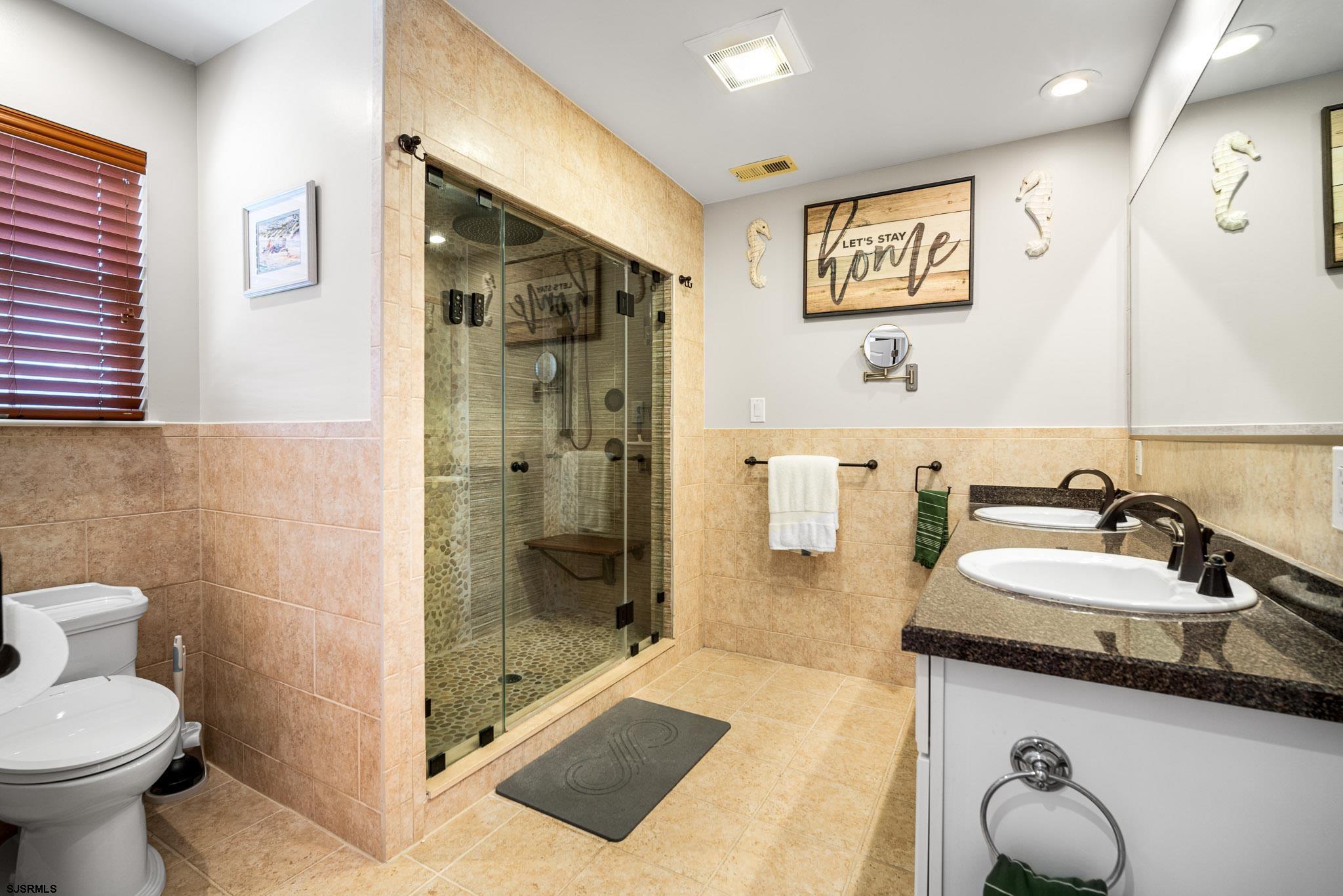 5 Collette Circle Brigantine, NJ 08203 - Photo 24 of 36 a spacious bathroom with a sink a toilet and shower