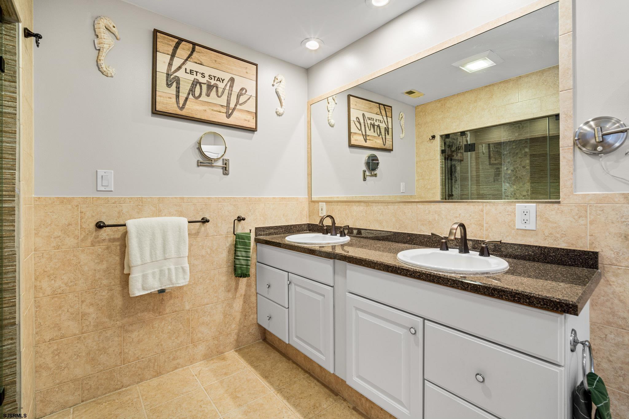 5 Collette Circle Brigantine, NJ 08203 - Photo 25 of 36 a bathroom with a sink and a mirror