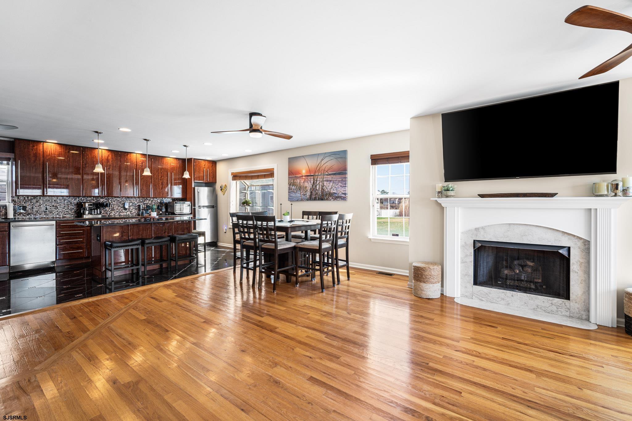 5 Collette Circle Brigantine, NJ 08203 - Photo 8 of 36 a living room with stainless steel appliances furniture and a flat screen tv