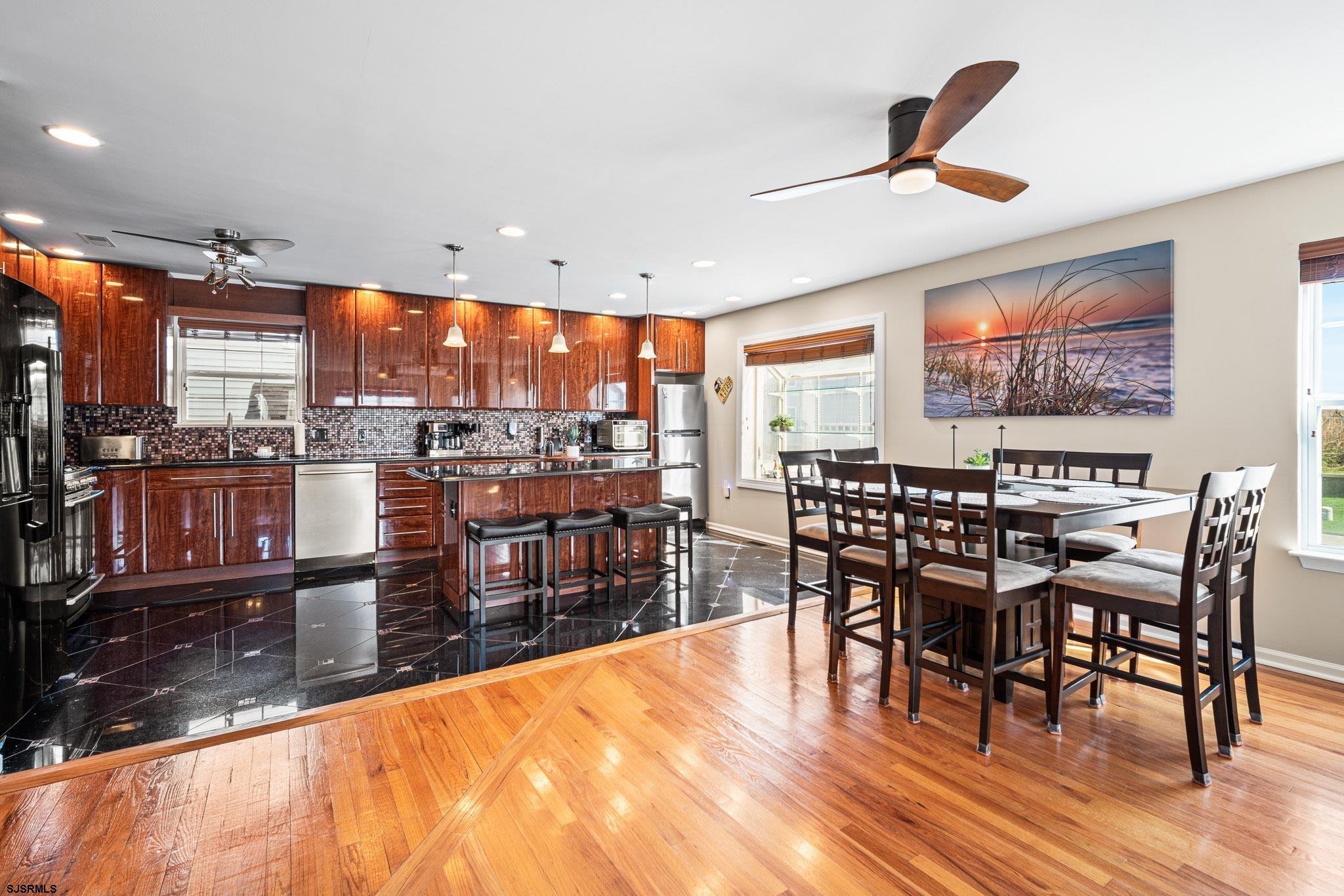 5 Collette Circle Brigantine, NJ 08203 - Photo 9 of 36 a dining room with furniture and wooden floor