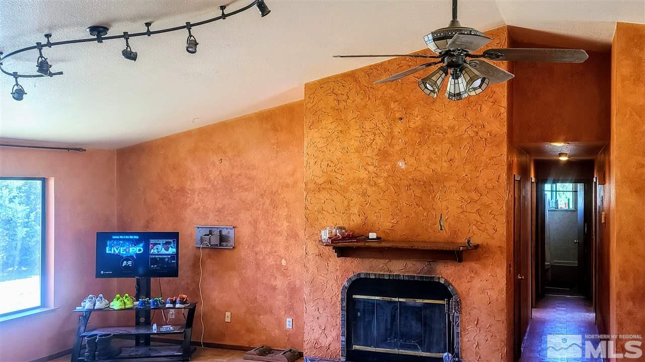 2440 Lousetown Road Reno, NV 89521 - Photo 8 of 20 a living room with furniture and a fireplace