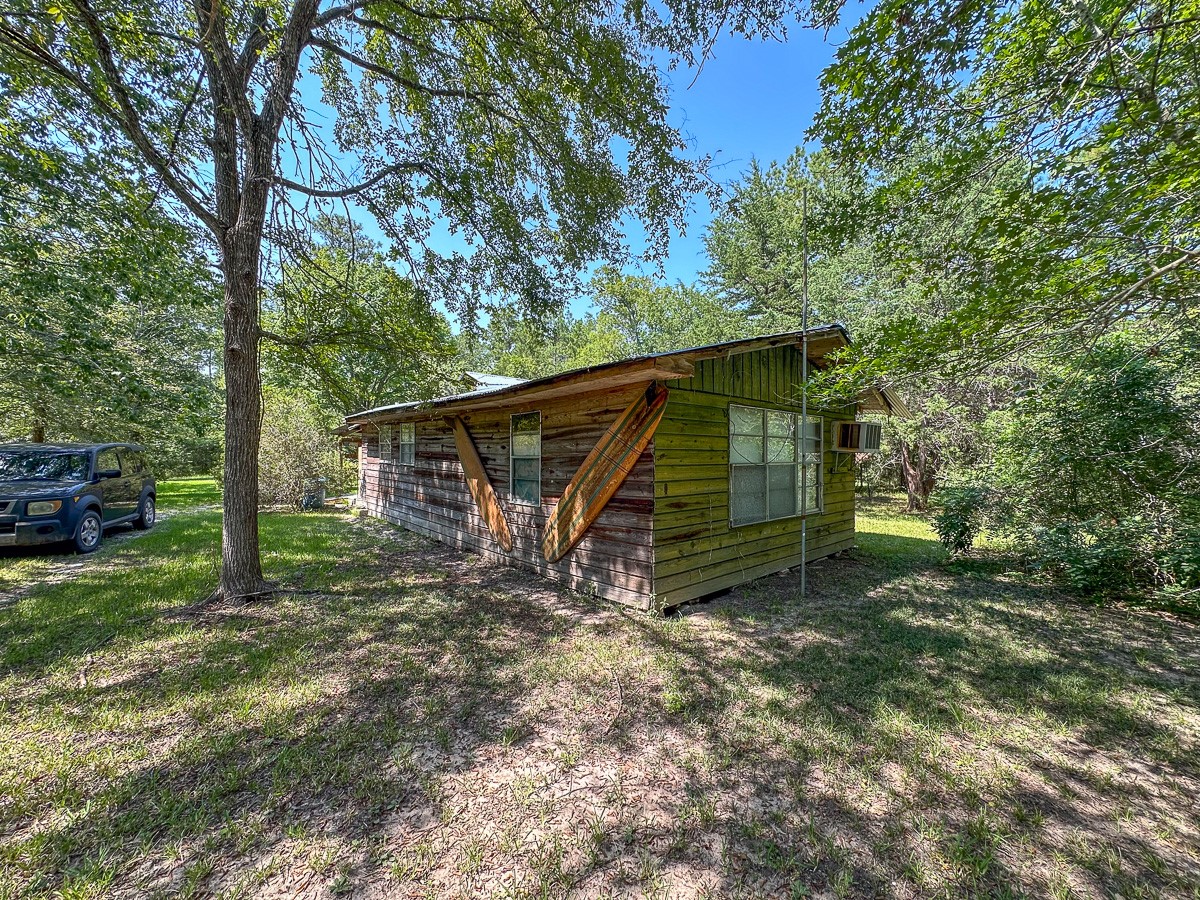 0 Fm 1374 Huntsville, TX 77340 - Photo 8 of 18 a view of a house with a yard