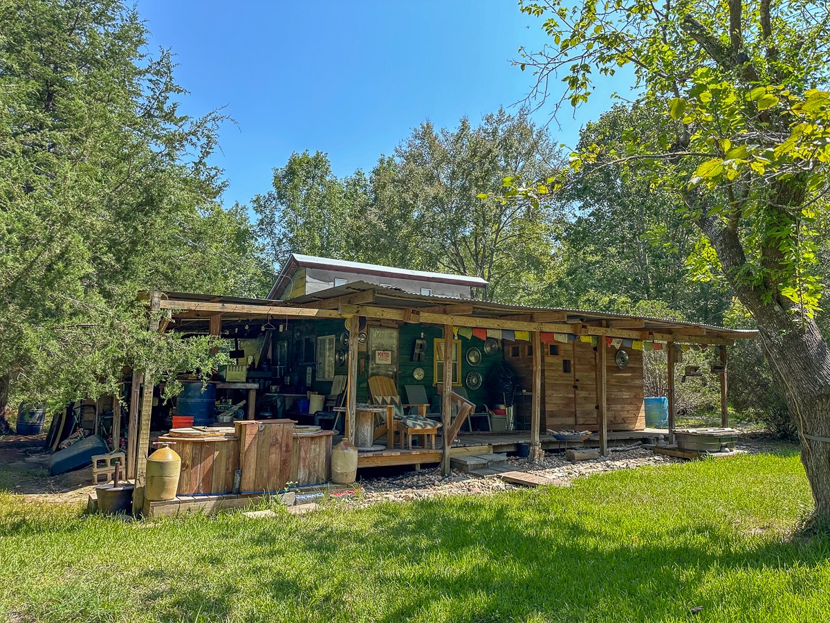 0 Fm 1374 Huntsville, TX 77340 - Photo 9 of 18 a view of a house with backyard porch and sitting area